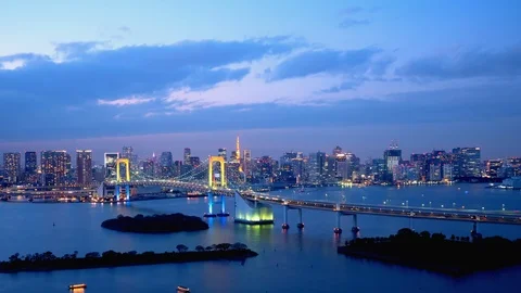 TimeLapse - Daytime to night scenery in Tokyo and Tokyo bay - Pan left to right Stock Footage 99716499