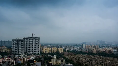 Timelapse of Delhi cityscape with clouds and under construction building Stock Footage 79840180