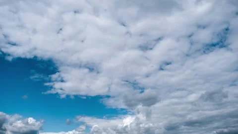 Timelapse of Dense Clouds Clearing to Reveal a Blue Sky Stock Footage 315243328