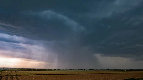 Timelapse depicting moving thunderstorm clouds with heavy rainfall. Stock Footage 301409853