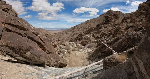 Timelapse of desert water collection system with clouds rolling past. Video stock 287886017
