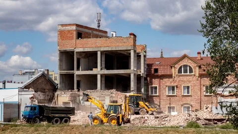 Timelapse dismantling a building using construction equipment. Stock Footage 121343318