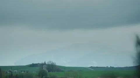 Timelapse of Distant Templar Chapel Surrounded by Forests and Moving Clouds Stock Footage 307113583