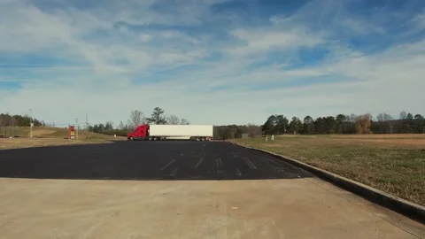 Timelapse of distant traffic a red and white semi truck and blue sky with clo Stock Footage 149599301
