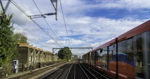 Timelapse of the Docklands in London in motion from a fast moving train Stock Footage 68985420