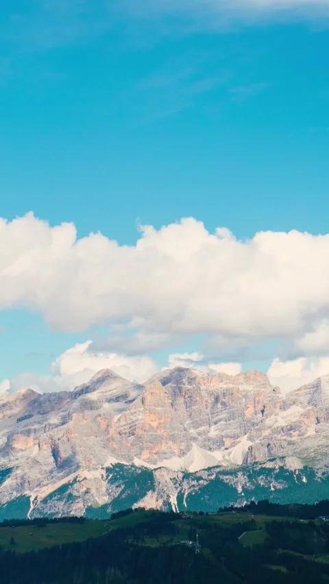 Timelapse Dolomites mountain range Italy jagged peaks moving clouds blue sk.. Stock Footage 336206694