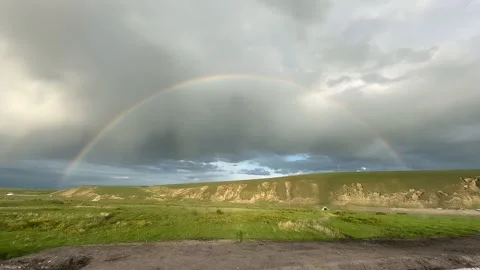 Timelapse: Double Rainbow Over a Green Plateau in Tibet, China at Evening Видео 336759054