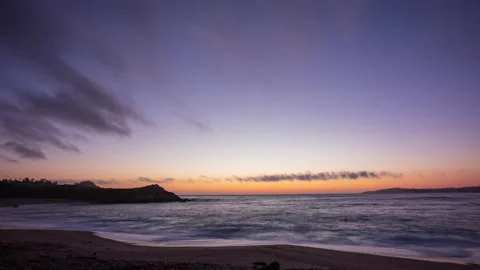 Timelapse - Dramatic and colorful sunset clouds at a California beach Stock Footage 234835163