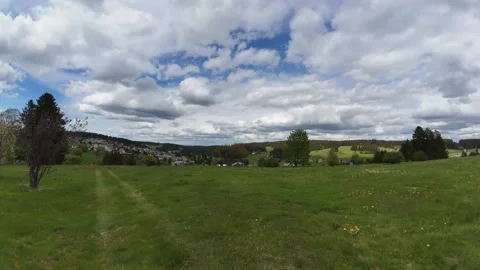 Timelapse of Dramatic Cloud Movement Above Green Countryside Stock Footage 335104737