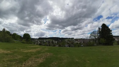 Timelapse of Dramatic Cloud Movement Above Green Countryside Stock Footage 335104770