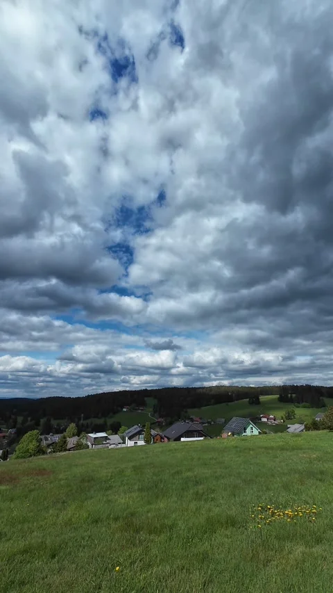 Timelapse of Dramatic Cloud Movement Above Green Countryside Stock Footage 335104791