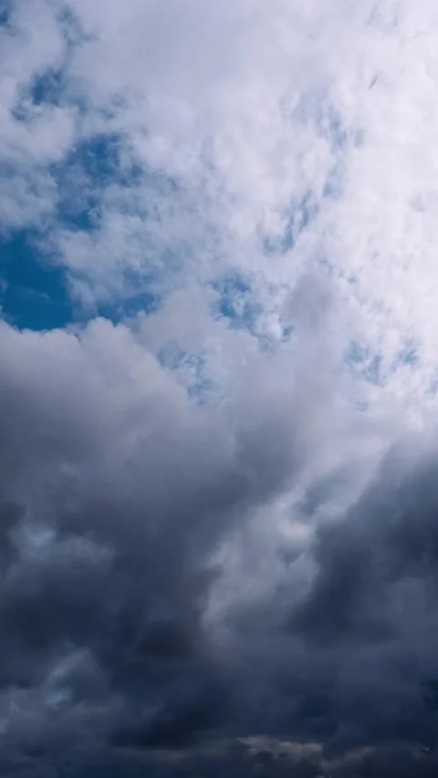Timelapse of Dramatic Clouds Moving Across a Blue Sky Stock Footage 311797636