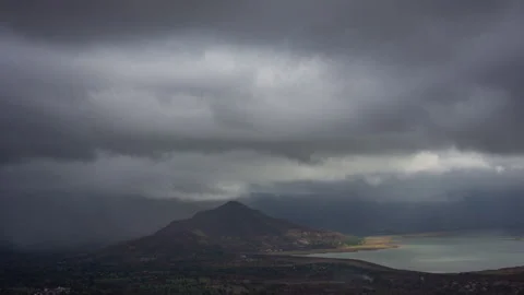 Timelapse - Dramatic clouds moving over a lake 4K60 Stock Footage 270084555