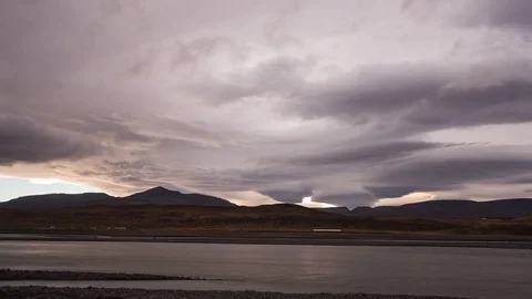 Timelapse of dramatic clouds moving at sunset Stock Footage 83702279
