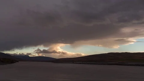 Timelapse of dramatic clouds moving at sunset Stock Footage 83702518