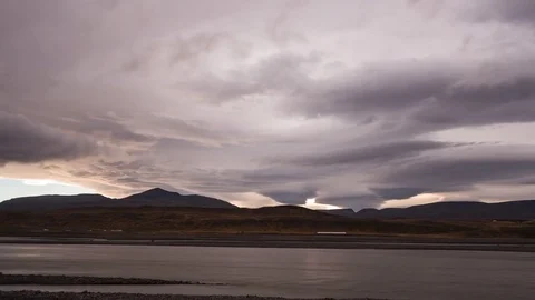 Timelapse of dramatic clouds moving at sunset Stock Footage 83702730