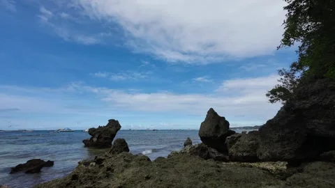 Timelapse Dramatic Clouds Over Boracay Philippines With Rocky Coast Foreground Stock Footage 333671394