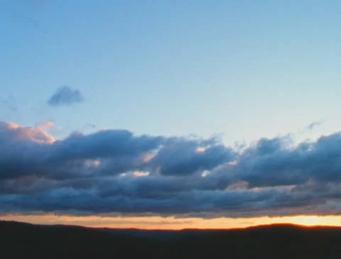 Timelapse: Dramatic clouds over the mountains (16mm, Ektachrome 100D) Stock Footage 254349313