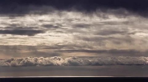 Timelapse of dramatic clouds passing by over the sea Stock Footage 68711876