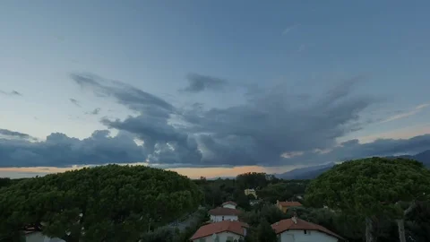 TIMELAPSE of dramatic evening clouds over the countryside of Tuscany during Stock Footage 76768173