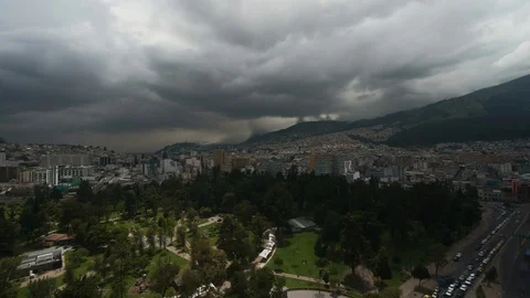 Timelapse dramatic gray cloud sky over modern big city surrounded by high Stock Footage 101834020