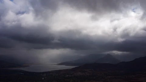 Timelapse - Dramatic rainy clouds moving over a lake 4K60 Stock Footage 270084521