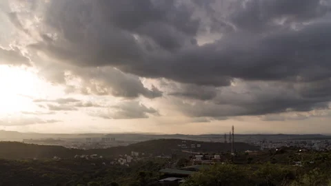 Timelapse - Dramatic rainy clouds over a city 4K30 Stock Footage 270431789