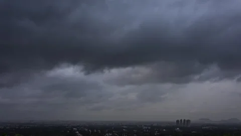 Timelapse - Dramatic rainy clouds over a city 4K30 Stock Footage 271198670