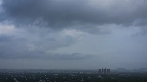 Timelapse - Dramatic rainy clouds over a city 4K30 Stock Footage 271198688