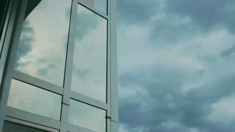 Timelapse of dramatic sky and as reflection on glass Stock Footage 141122662
