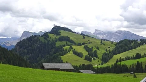 Timelapse of dramatic sky looming over a green meadow Stock Footage 283537334