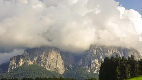 Timelapse of dramatic sky looming over majestic mountain range in the distanc Stock Footage 283538822