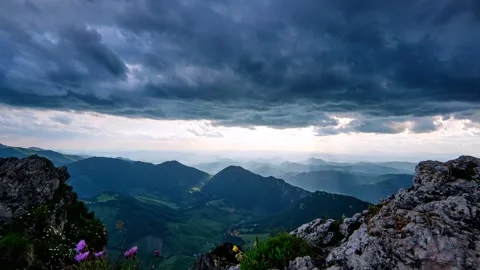 Timelapse , Dramatic Storm Clouds Dissolve Revealing the Rising Sun over a 스톡 동영상 313593864