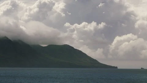 Timelapse of dramatic storm clouds forming above volcanic coastline in the Stock Footage 340505461