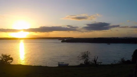 Timelapse of Dramatic sunset on the lake. Fall of the sun in Tibau do sul. Stock Footage 110844937