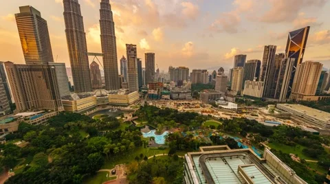 Timelapse of dramatic sunset over KLCC Park. Motion Pan Up Video stock 59940903