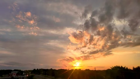 Timelapse of Dramatic Sunset Sky and Moving Clouds Over Horizon Stock Footage 345858873