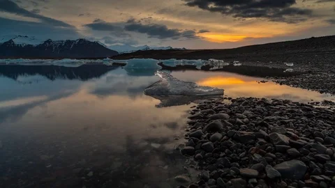 Timelapse of dramatic sunset sky over the glacial lagoon Stock Footage 73010999