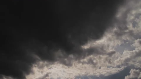 Timelapse of a dramatic weather change from blue sky to a dark dramatic storm Stock Footage 196686671