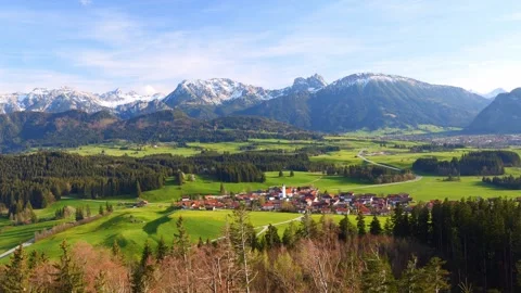 Timelapse of drifting clouds over vast mountain landscapes, showcasing the se Stock Footage 309186257