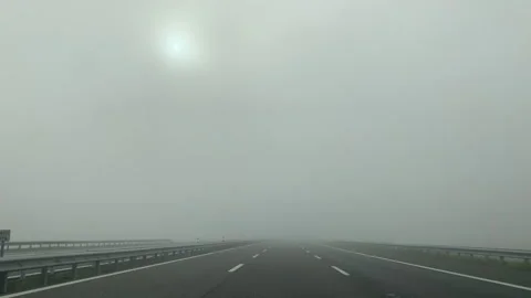 Timelapse - Driving on an empty highway with thick fog Видео 143570756