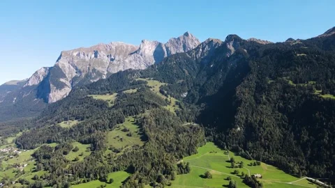 Timelapse drone climb toward alpine peak above Maienfeld valley Stock Footage 331877964