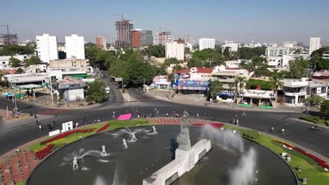Timelapse drone view over La Minerva roundabout with people in Guadalajara Stock Footage 319508179