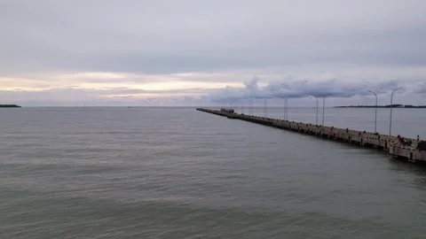 Timelapse drone view from the pier, ocean, and clear sky Stock Footage 258321811