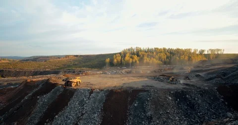 Timelapse dump trucks spill out an earth and a stones Stock Footage 122075800