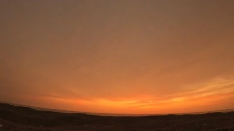 Timelapse of dusk on the beach from the sand Stock Footage 145593586