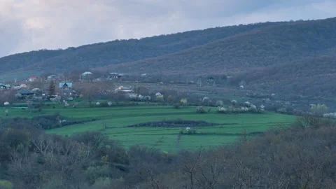 Timelapse of an early spring sunset over a remote Georgian village Stock-Footage 332718297