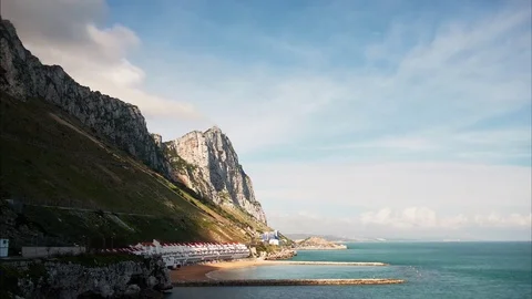 Timelapse of the Eastern coast of the Rock of Gibraltar with Sandy Bay Stock Footage 77455137