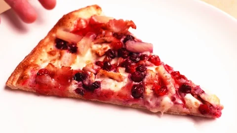 Timelapse of eating a pizza slice with chicken, pineapple and cowberry. Close-up Stock Footage 123660751