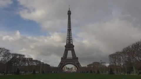 Timelapse of Eiffel Tower and Champ de Mars sunny cloud day pass toutism paris Stock Footage 10772350
